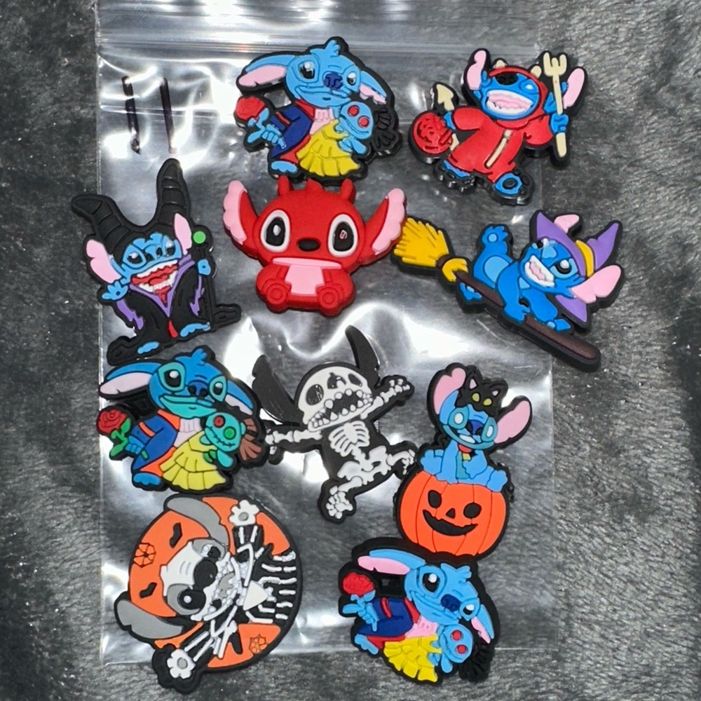 ten pice set of random stitch croc charms NEW